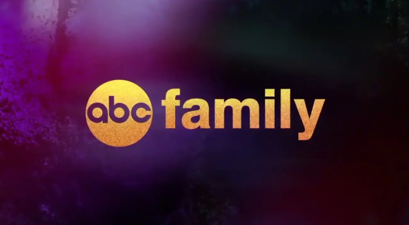 A gold and black logo for abc family.